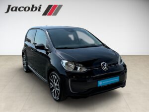 ```html
Alt="Schwarzer Volkswagen E-Up in Showroom mit Jacobi-Logo."
```