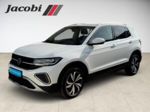 Silberner Volkswagen-SUV in einem Raum, Logo "Jacobi" oben links sichtbar.